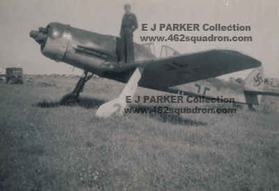 14 James Edwin PARKER 428504 on wing of Luftwaffe aircraft, Germany 1945.
