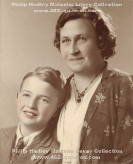 Colour tinted studio portrait of young Philip Hedley Malcolm Levey with his mother Ruth Woolnough Levey.