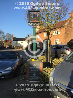 Village sign with 2 Memorial Plaques, in central Foulsham, commemorating all Squadrons based at RAF Foulsham (462 Squadron), visited 23 February 2019.