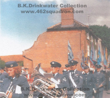 RAF Band Honington, followed by ex-RAF veterans and Standards Bearers process through Foulsham towards the Village Sign for the unveiling of Memorial Plaques, 27 August 1989. 