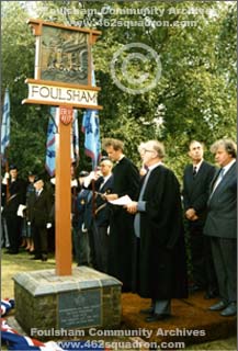 The ceremony for the unveiling of the Memorial Plaques at the Foulsham Village Sign, 27 August 1989, showing the southern side of the sign and plinth with one of the plaques.