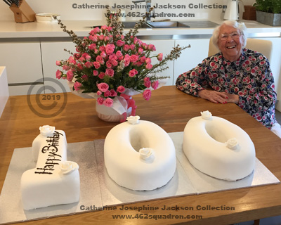 Ex-WAAF Catherine Josephine JACKSON, formerly WOOD-BROWN, nee BURTON,with cake and flowers, on her 100th Birthday, in 2019.