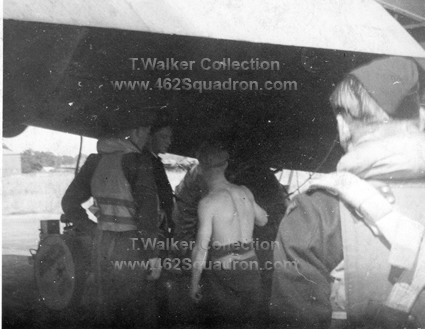 462 Squadron Foulsham, Sgt Tom Walker, F/O Neil Sullivan, F/Sgt Bill Railton checking wheels under Halifax Z5-A